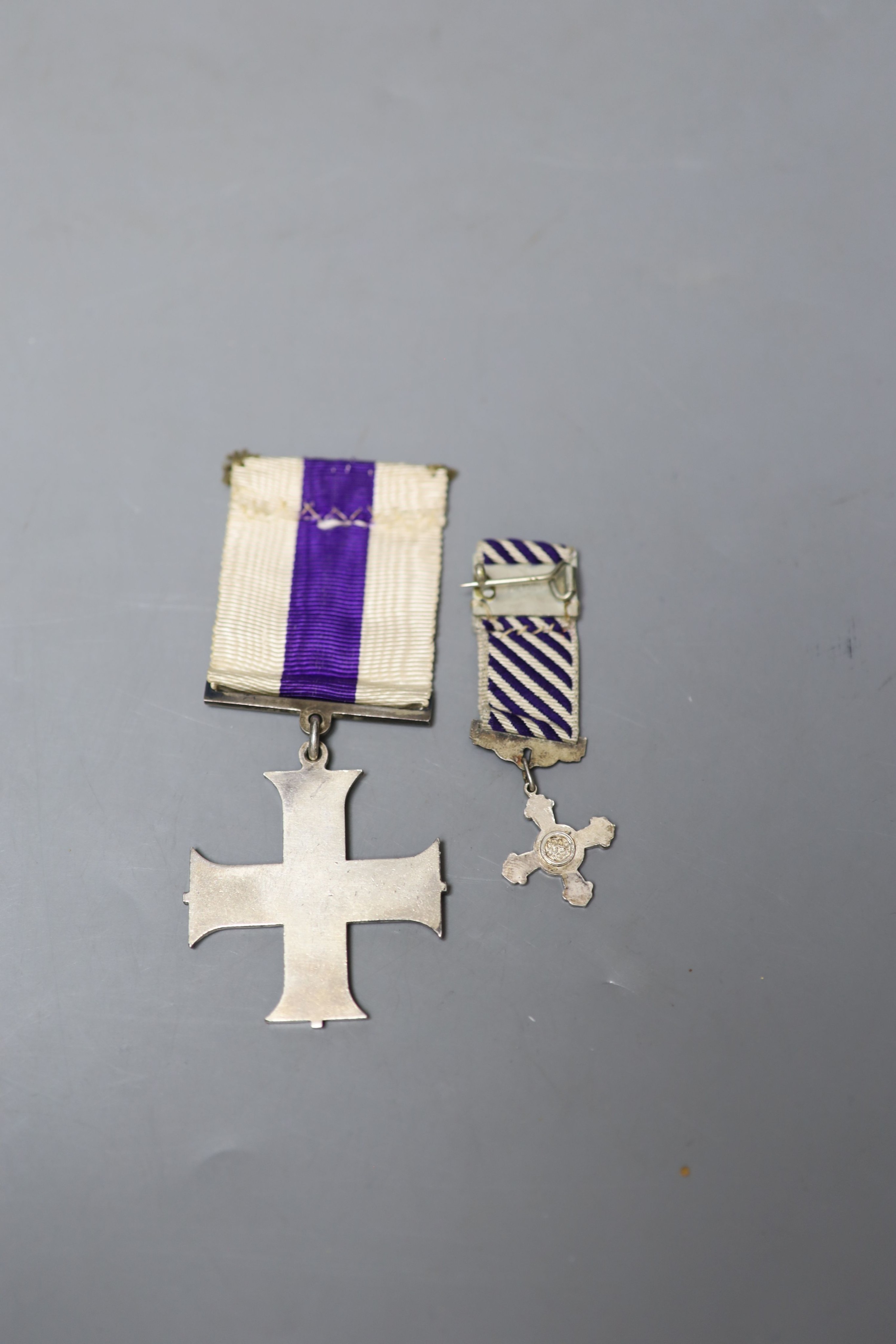 An unnamed Military Cross and a Distinguished Flying Cross miniature